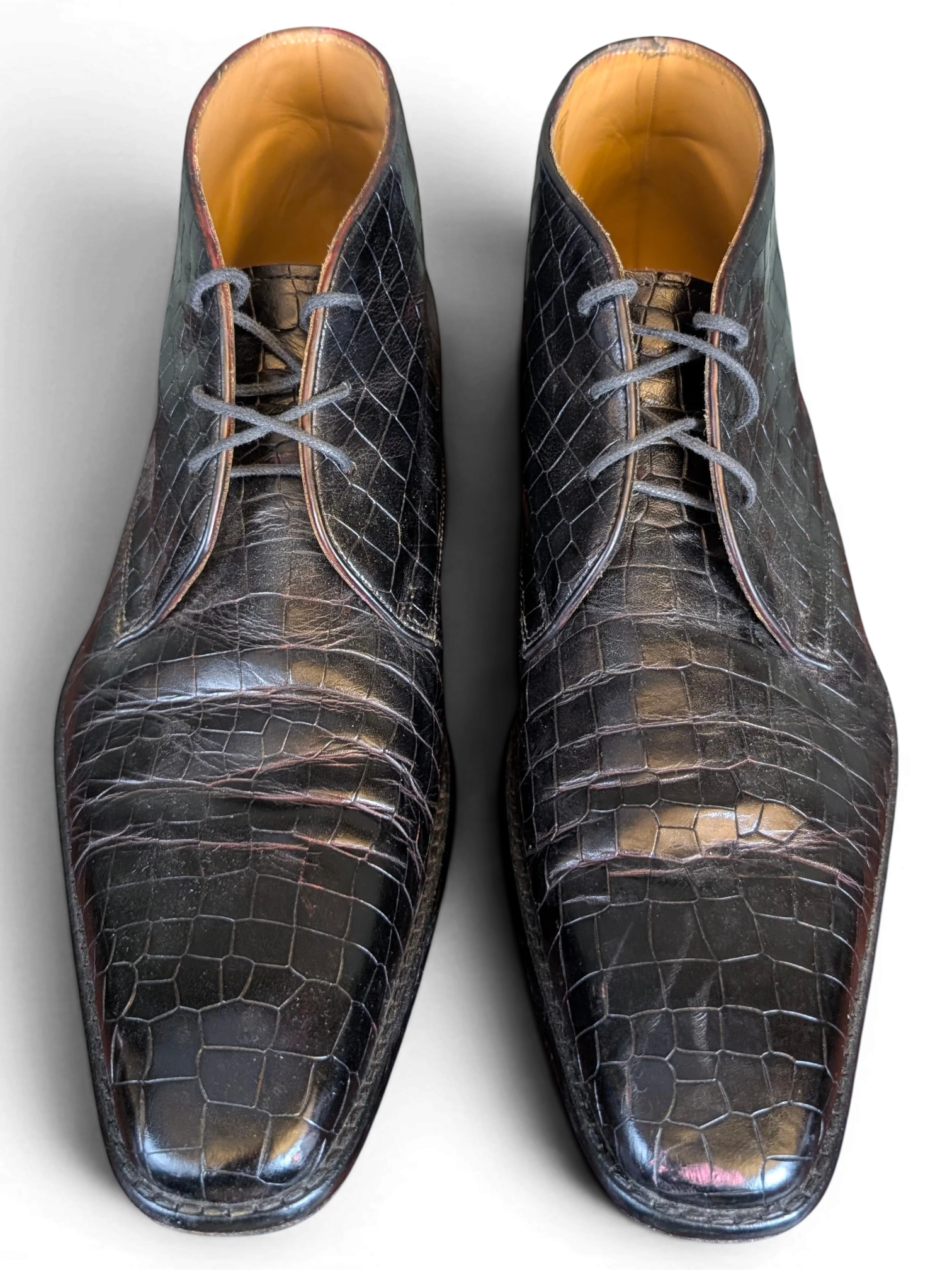 JAKE & IPI Melvin & Hamilton dark brown crocodile-embossed leather ankle boots with lace-up closure.