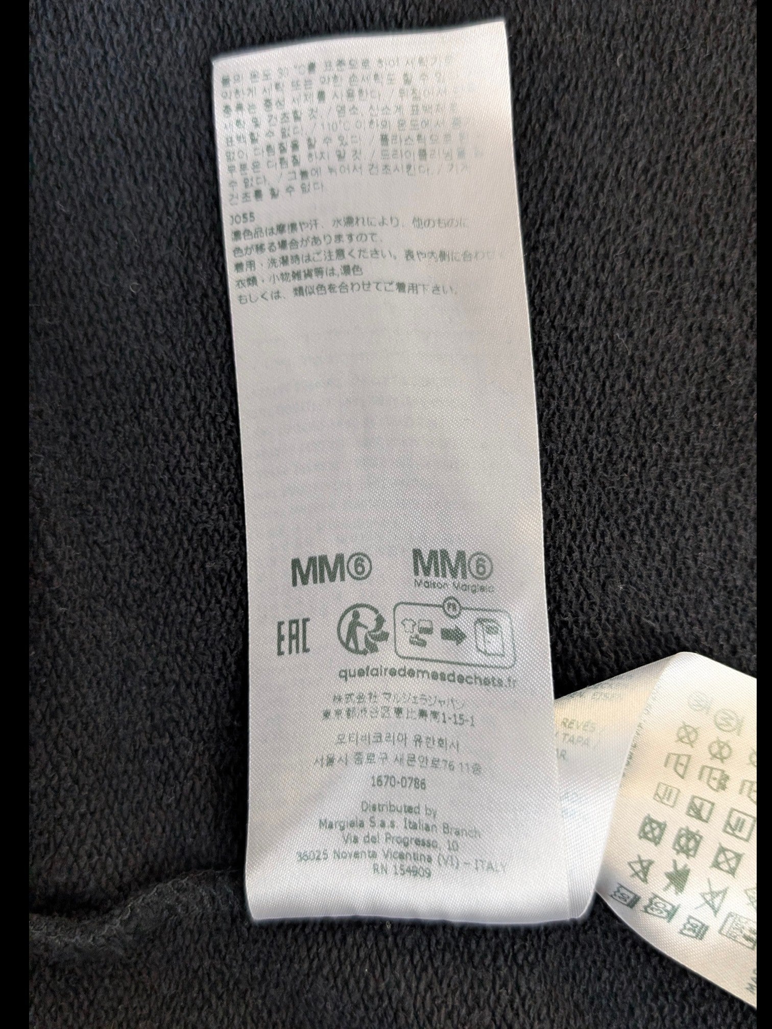 JAKE & IPI MM6 Maison Margiela garment care label with washing instructions and brand information