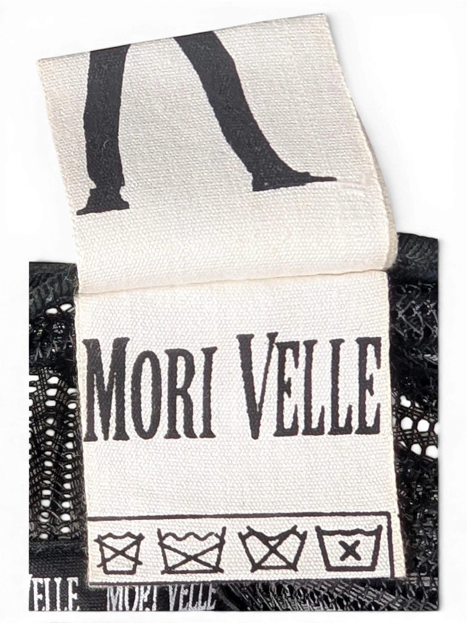 JAKE & IPI IBE Morivelle cap interior fabric care label with brand logo and washing instructions
