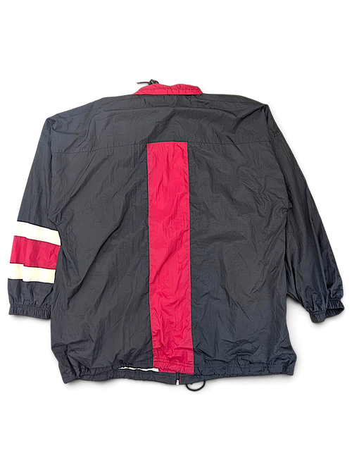 Active Elements Black and Red Stripe Windbreaker; Back view showing vertical red panel and an opening at the hem.