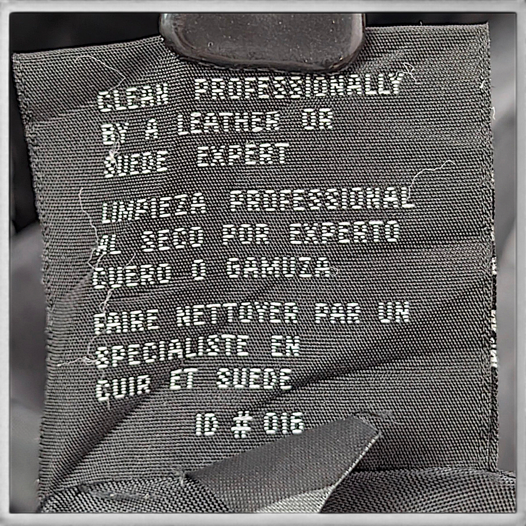 JLC New York Black Genuine Leather Zip Coat – L – care label.