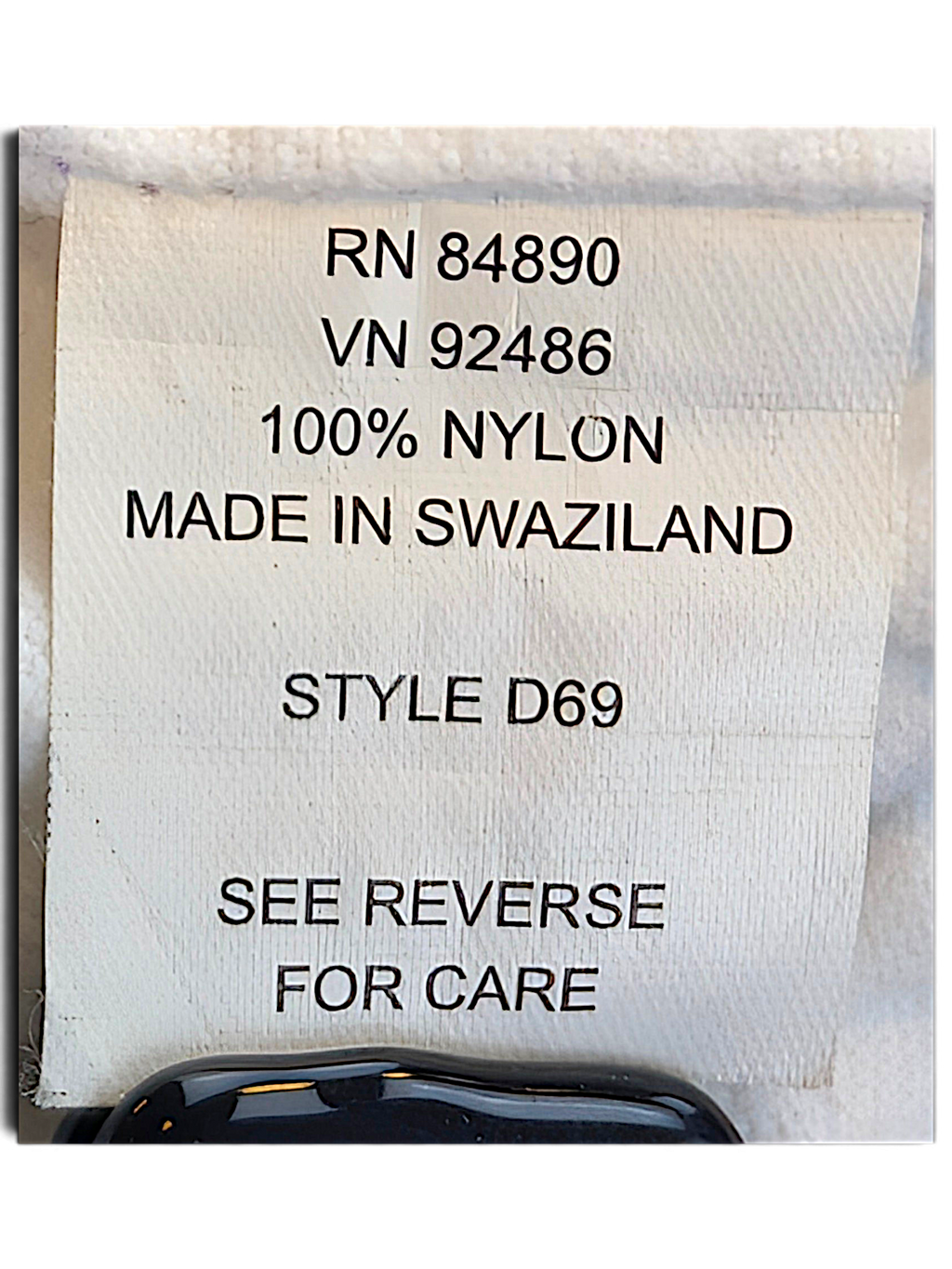 Tudor Court Lilac Snap Front Jacket; 100% nylon composition label.