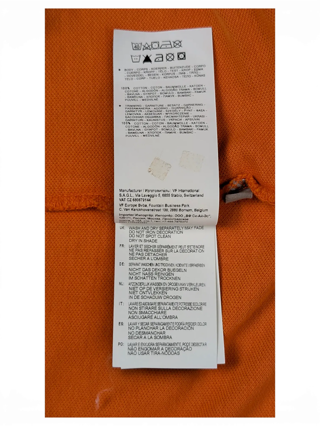 JAKE & IPI Napapijri orange polo shirt care and material label with washing instructions in multiple languages