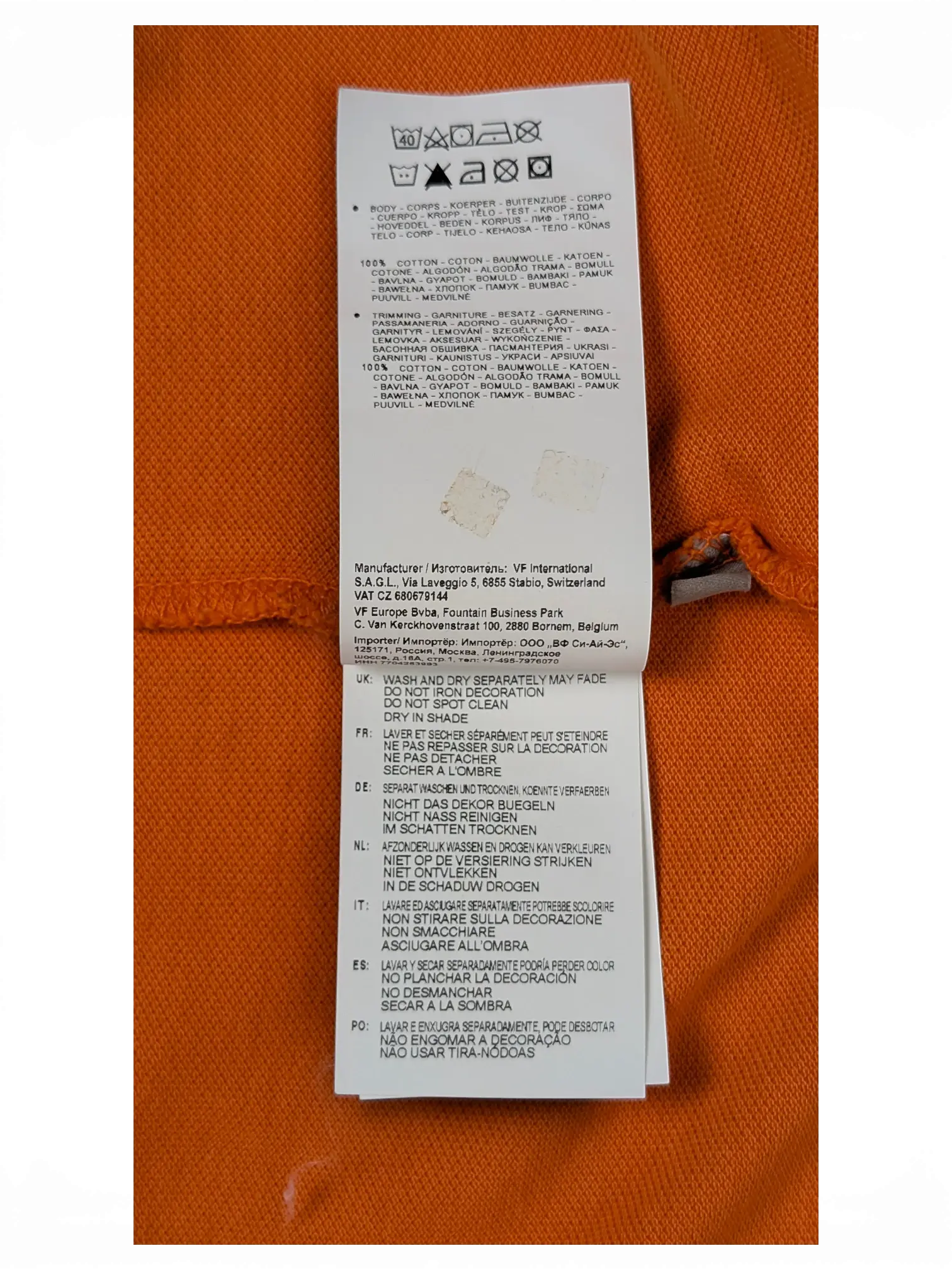 JAKE & IPI Napapijri orange polo shirt care and material label with washing instructions in multiple languages