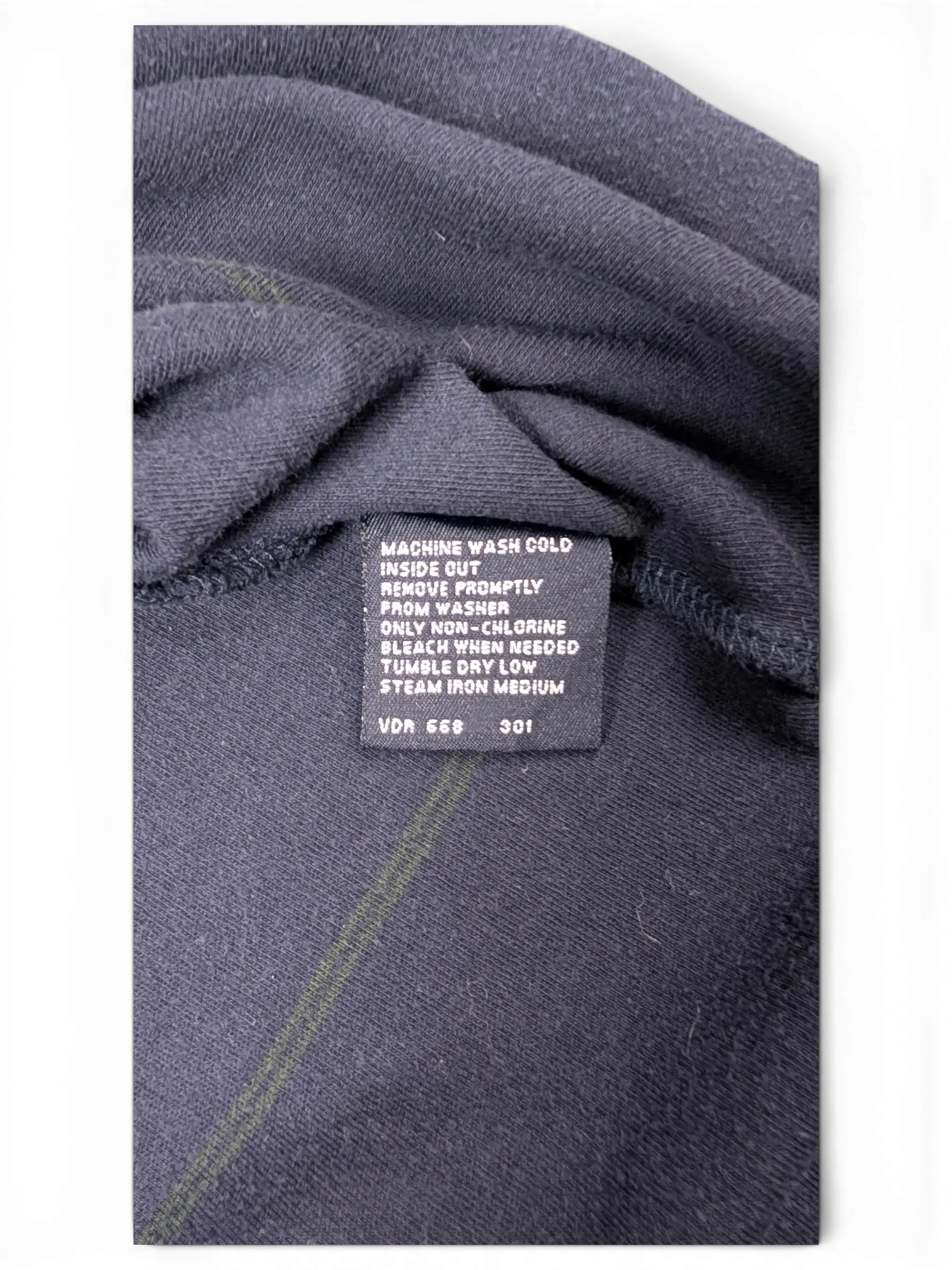 JAKE & IPI Nautica navy polo shirt care instruction label with fabric details