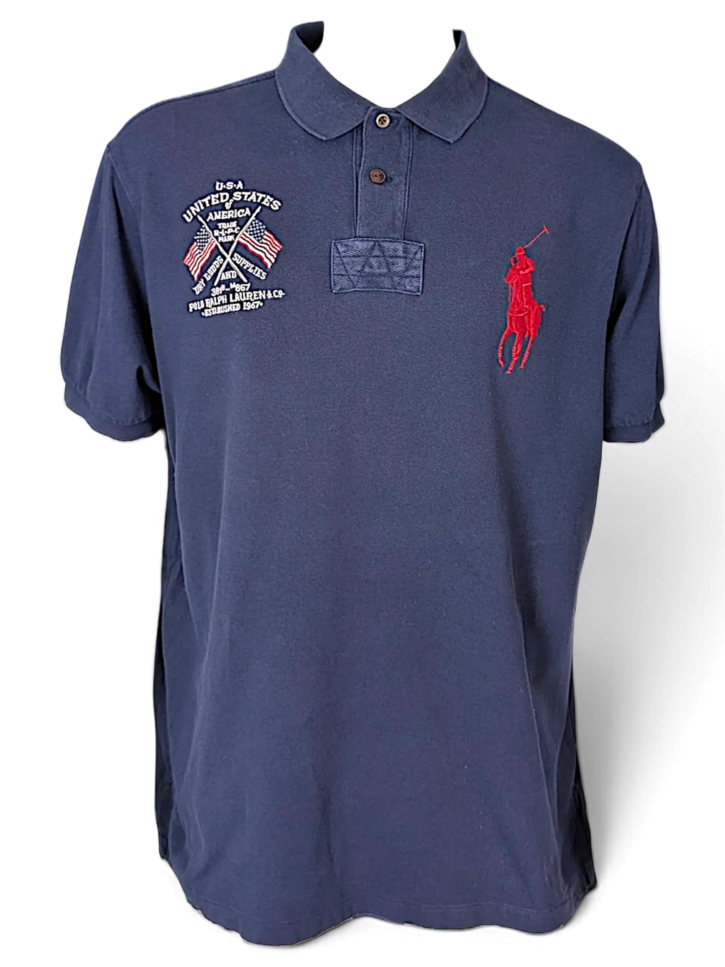 JAKE & IPI navy blue cotton polo shirt featuring a red Big Pony logo and USA flag embroidery on the chest.