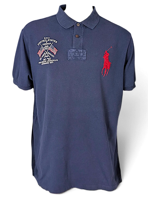 JAKE & IPI navy blue cotton polo shirt featuring a red Big Pony logo and USA flag embroidery on the chest.