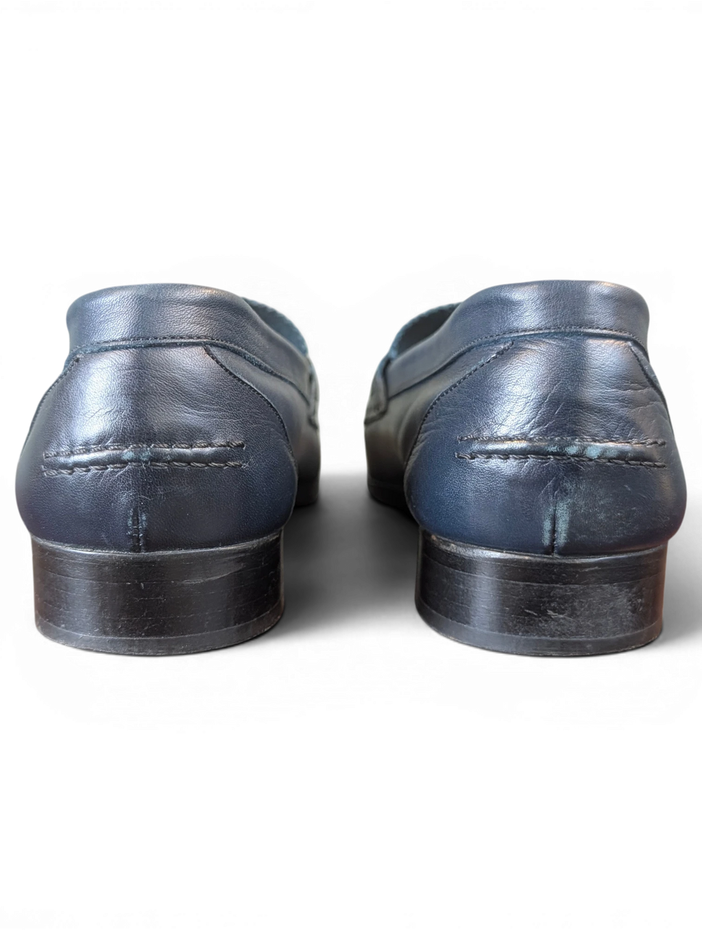Rear view of JAKE & IPI navy blue leather loafers featuring a low stacked heel and detailed stitching.