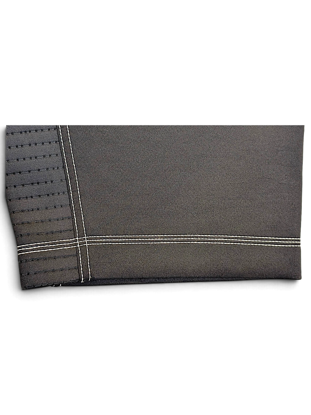 JAKE & IPI Nike Dri-FIT black performance track pants featuring detailed white contrast stitching and hem texture.