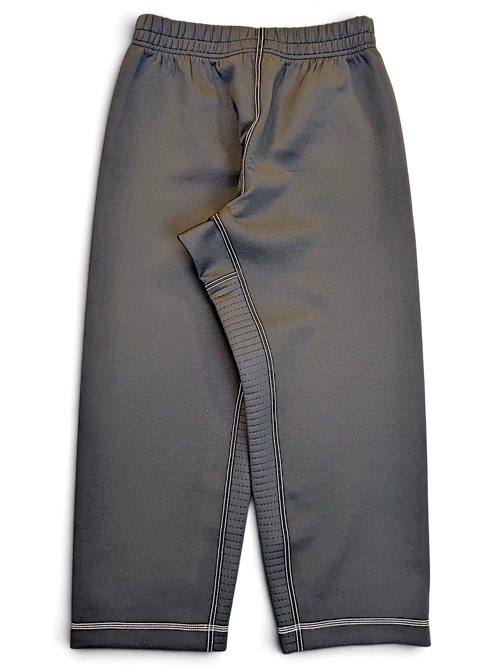 JAKE & IPI pre-owned Nike black Dri-FIT performance track pants with white contrast stitching and a streamlined fit.