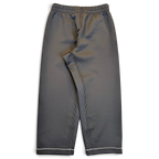 JAKE & IPI pre-owned Nike black Dri-FIT performance track pants with white contrast stitching and a streamlined fit.