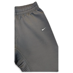 JAKE & IPI pre-owned black Nike Dri-FIT performance track pants with white Swoosh logo and contrast stitching
