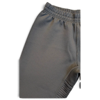 JAKE & IPI Nike Dri-FIT black performance track pants with elastic waistband and white contrast stitching detail.