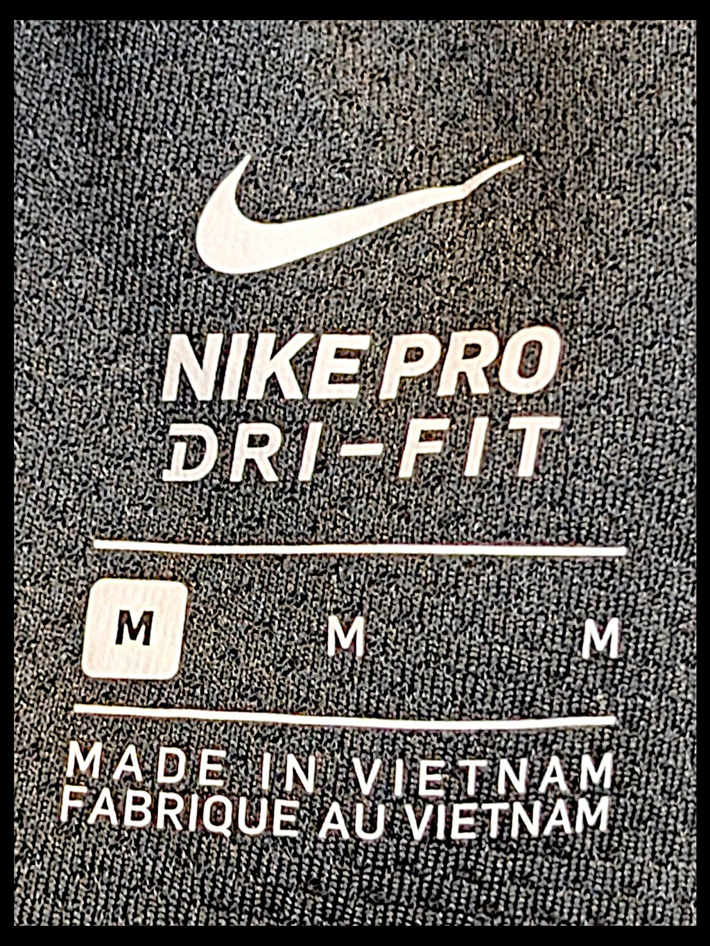 JAKE & IPI Nike Pro Dri-FIT black track pants size M label detail with Swoosh logo