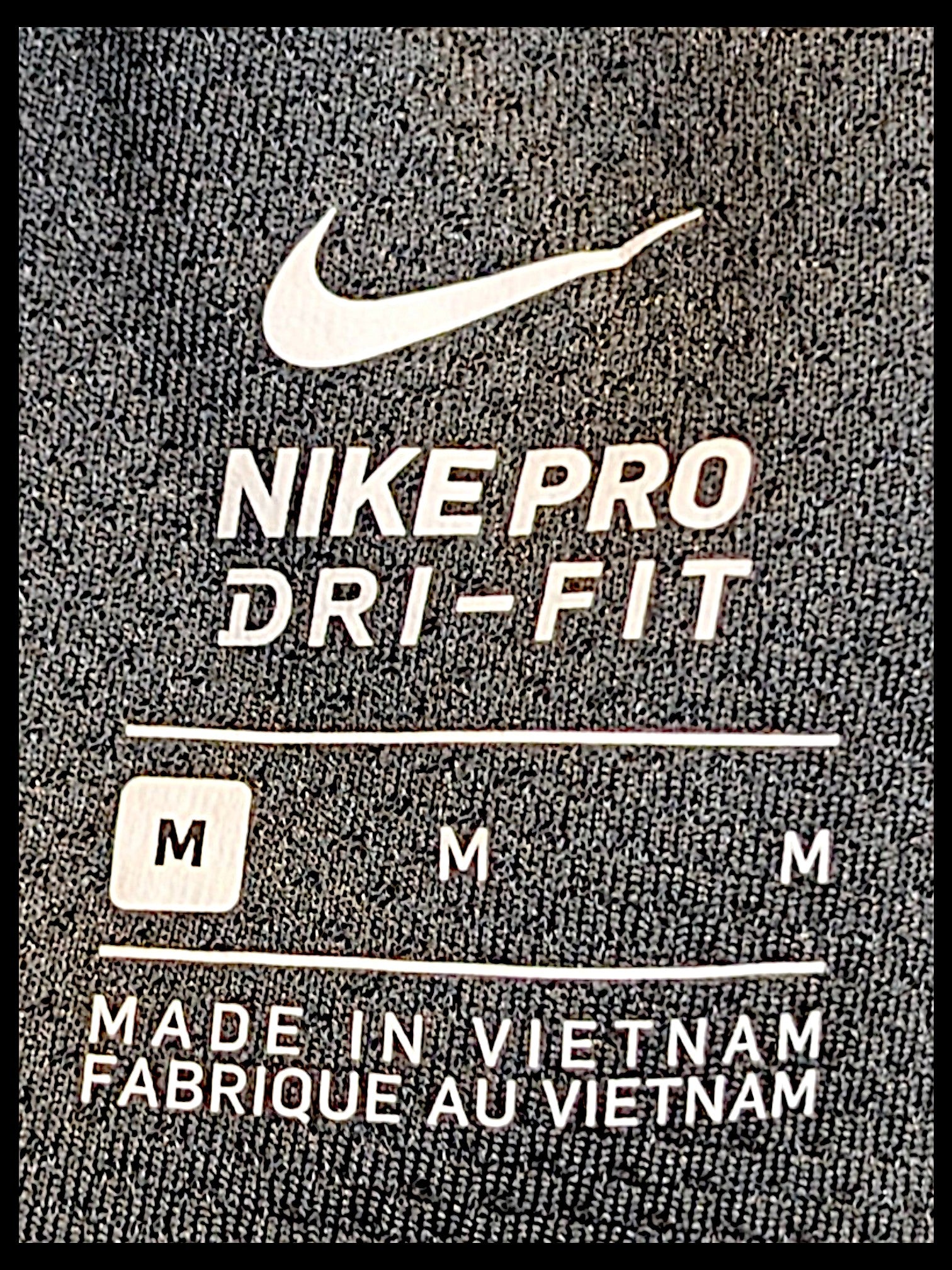 JAKE & IPI Nike Pro Dri-FIT black track pants size M label detail with Swoosh logo