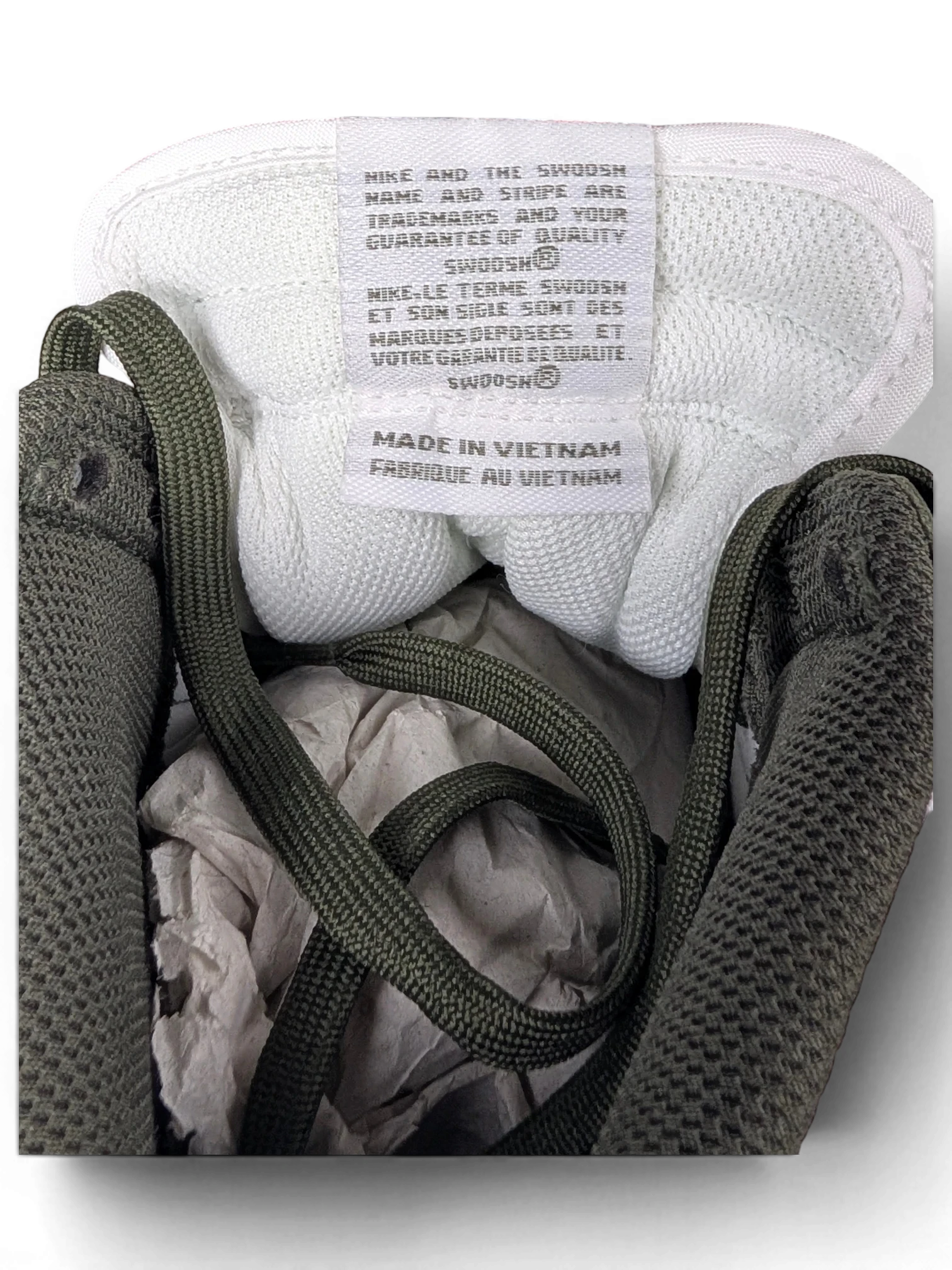JAKE & IPI Nike Dunk High Cargo Khaki sneaker interior showing white tongue label and green mesh lining