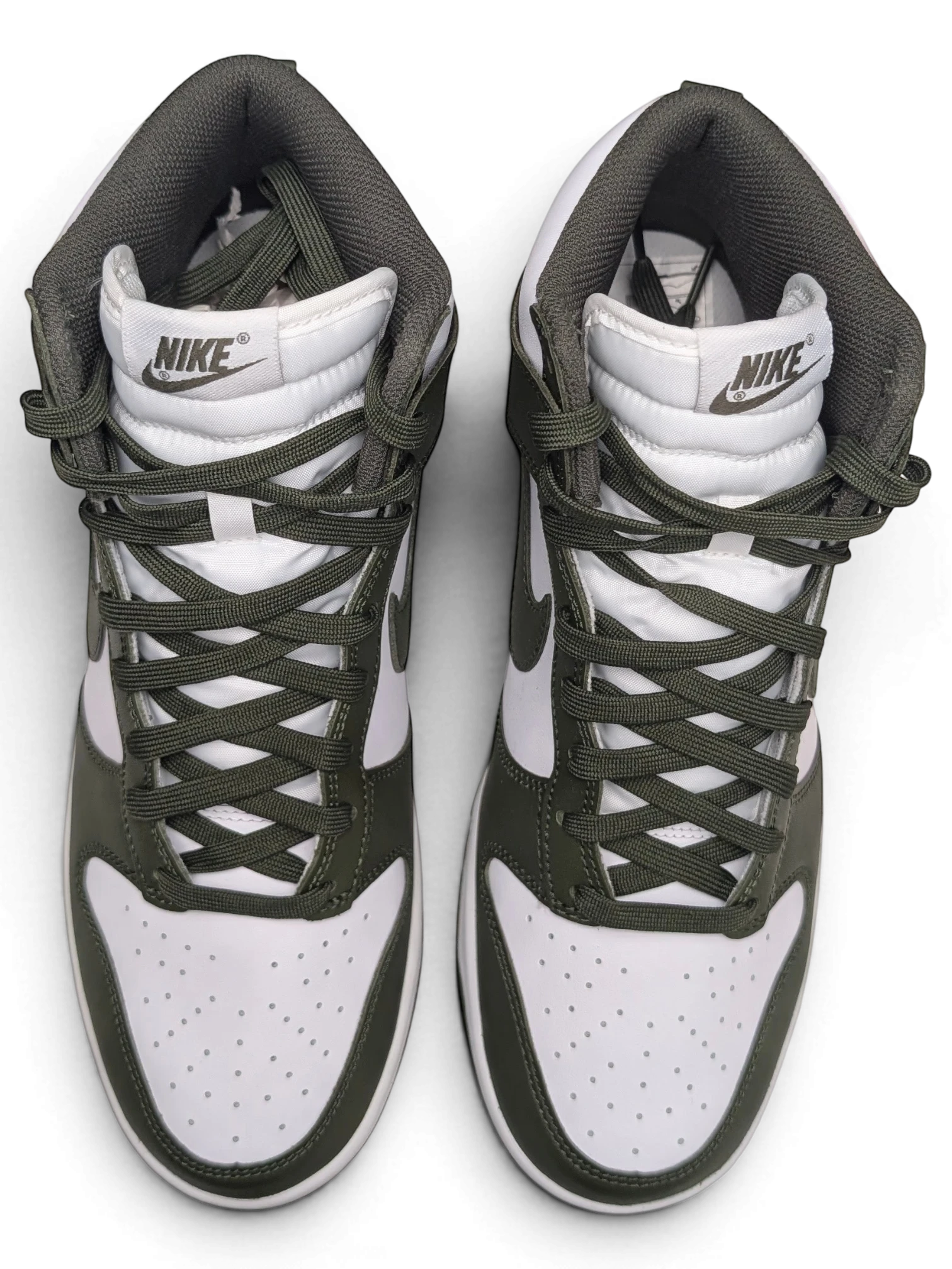 JAKE & IPI Nike Dunk High sneakers in white and Cargo Khaki leather with matching laces and high-top silhouette.
