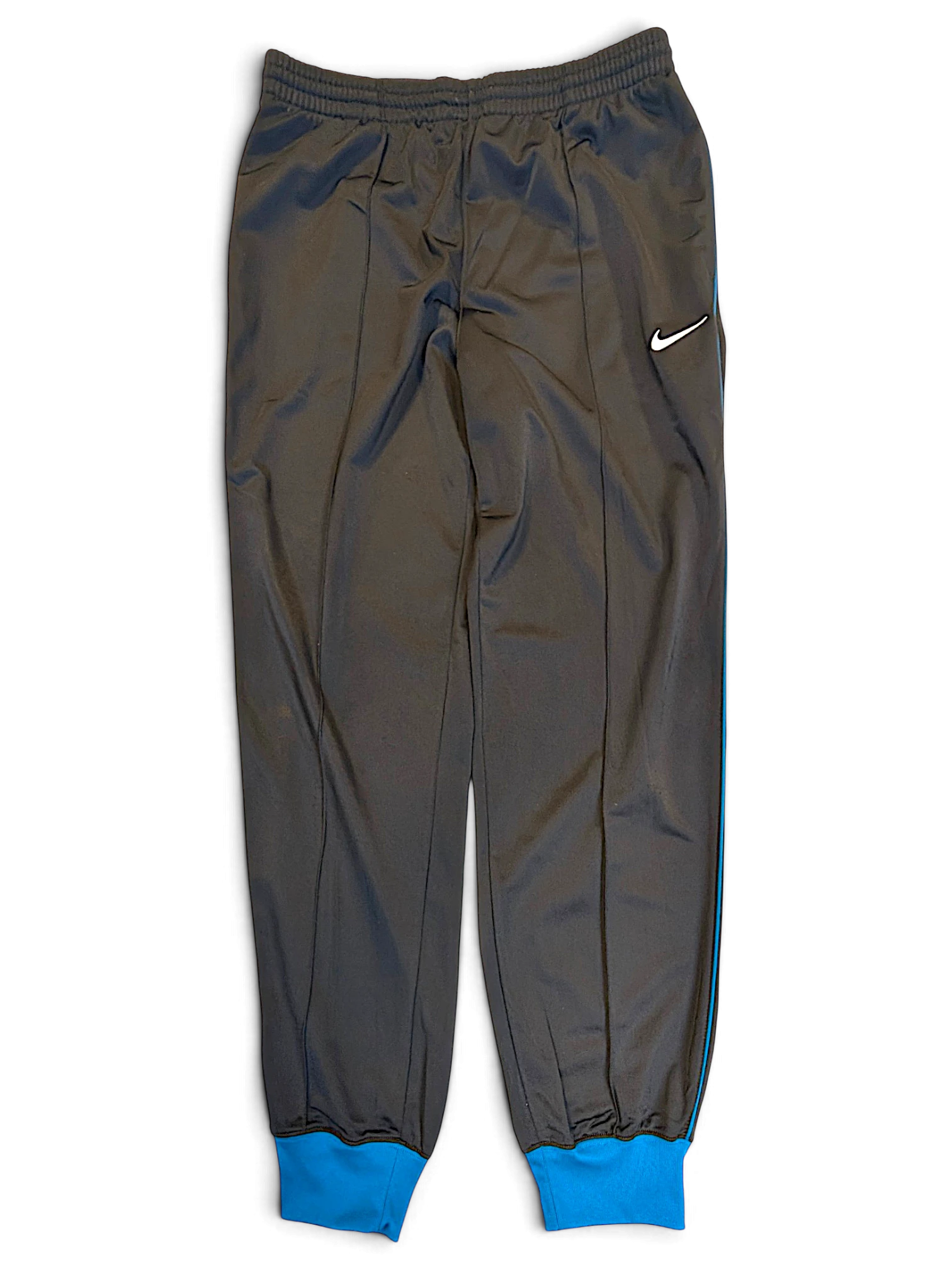 JAKE & IPI pre-owned Nike grey polyester track pants with blue piping, contrast cuffs, and white Swoosh logo.