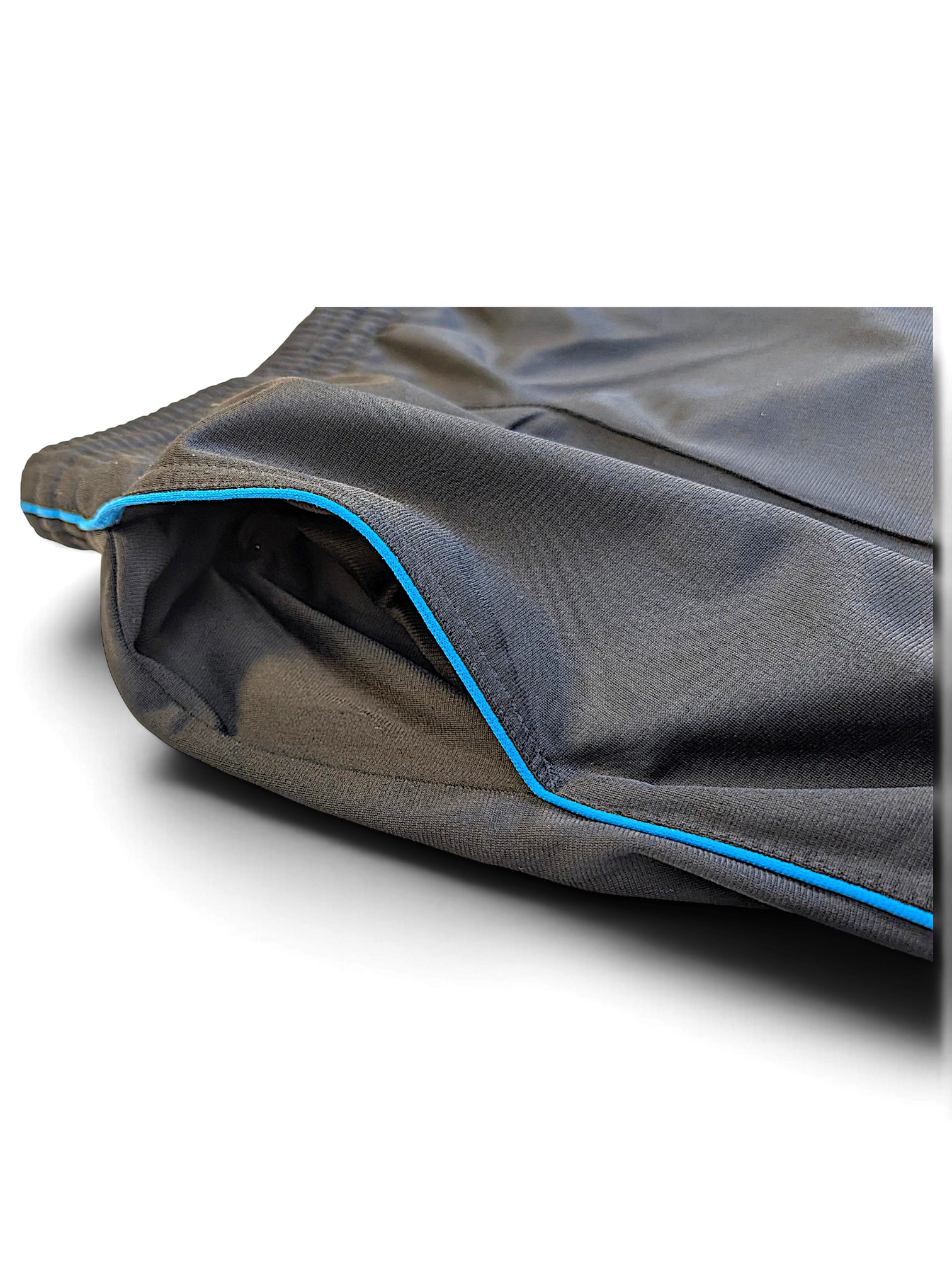JAKE & IPI Nike grey and black polyester track pants featuring vibrant blue piping detail on the pocket