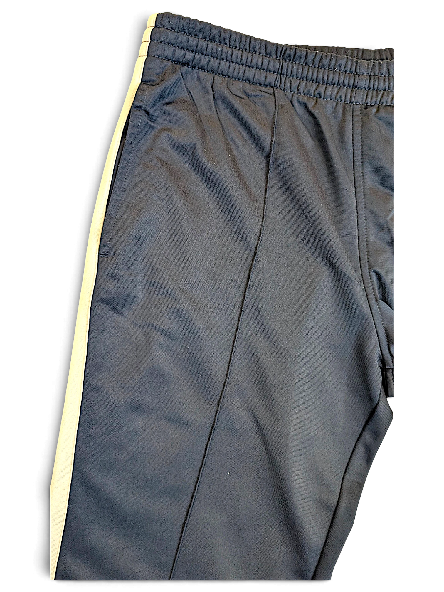 JAKE & IPI Nike navy track pants with a white side stripe and elasticated waistband