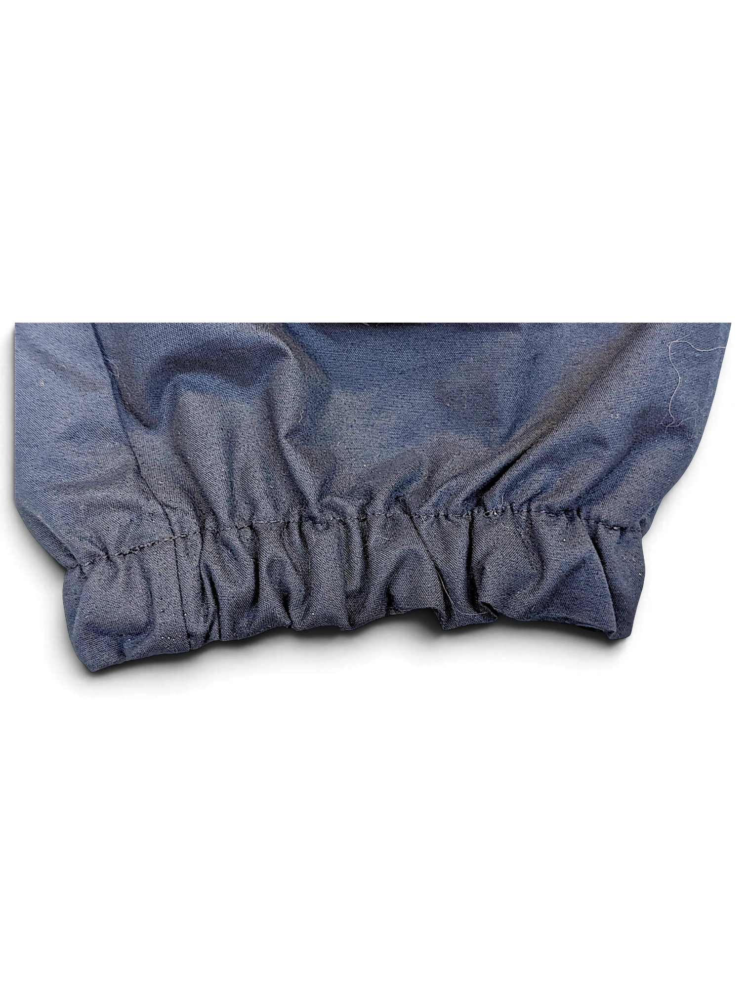 JAKE & IPI Nike navy windbreaker track pants featuring an elasticated cuffed leg opening in good pre-owned condition.