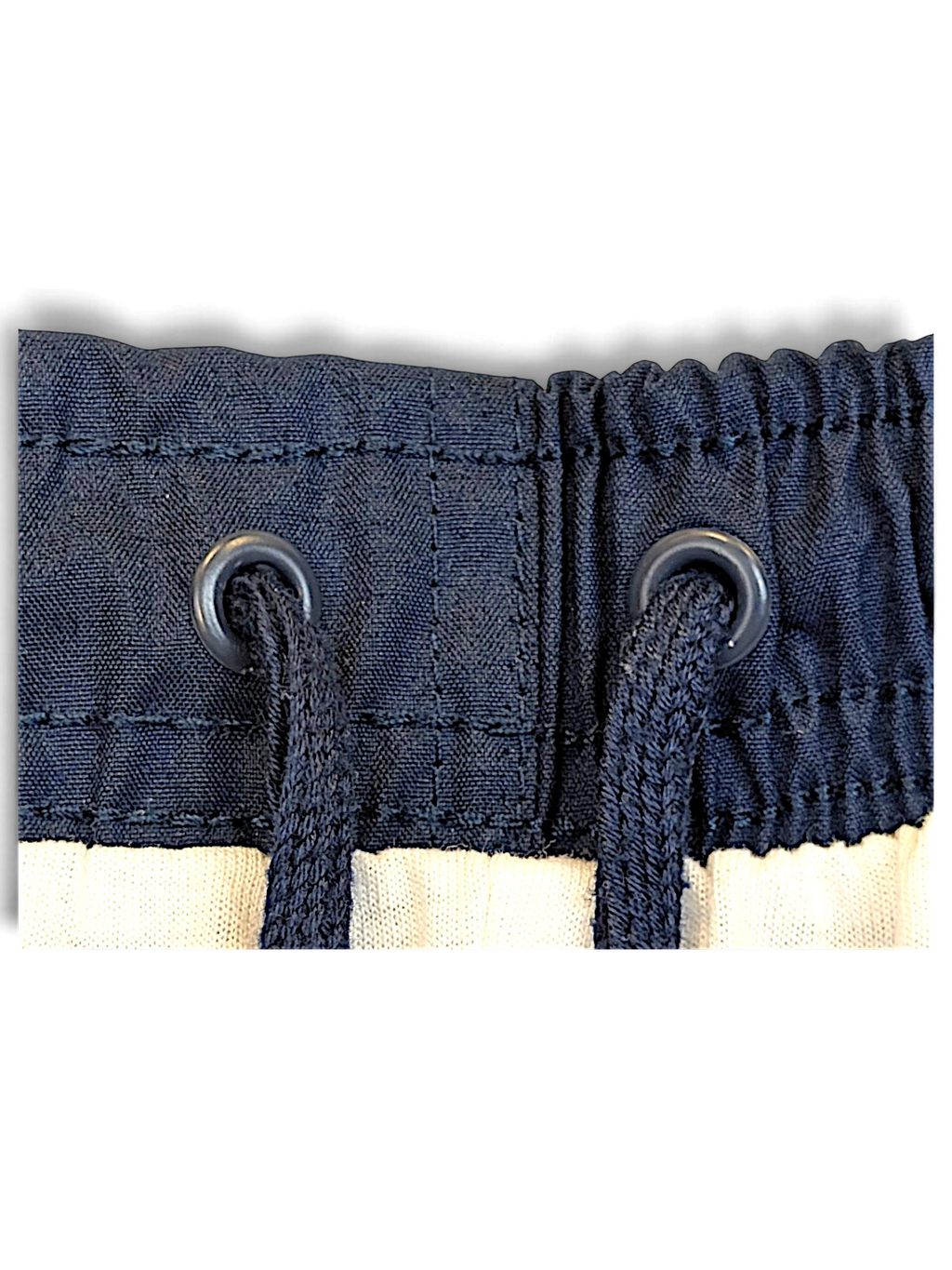 JAKE & IPI Nike navy windbreaker track pants featuring an elasticated waistband with matching drawstring eyelets