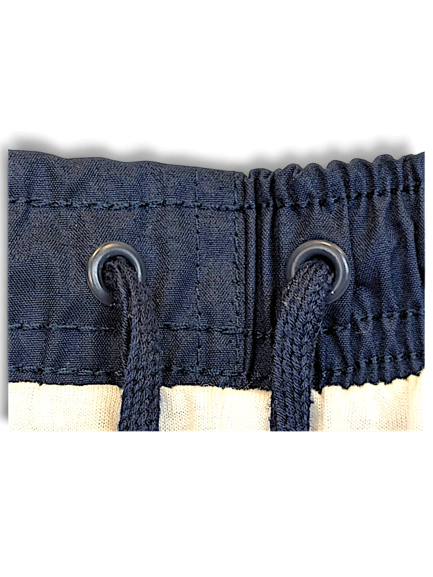 JAKE & IPI Nike navy windbreaker track pants featuring an elasticated waistband with matching drawstring eyelets