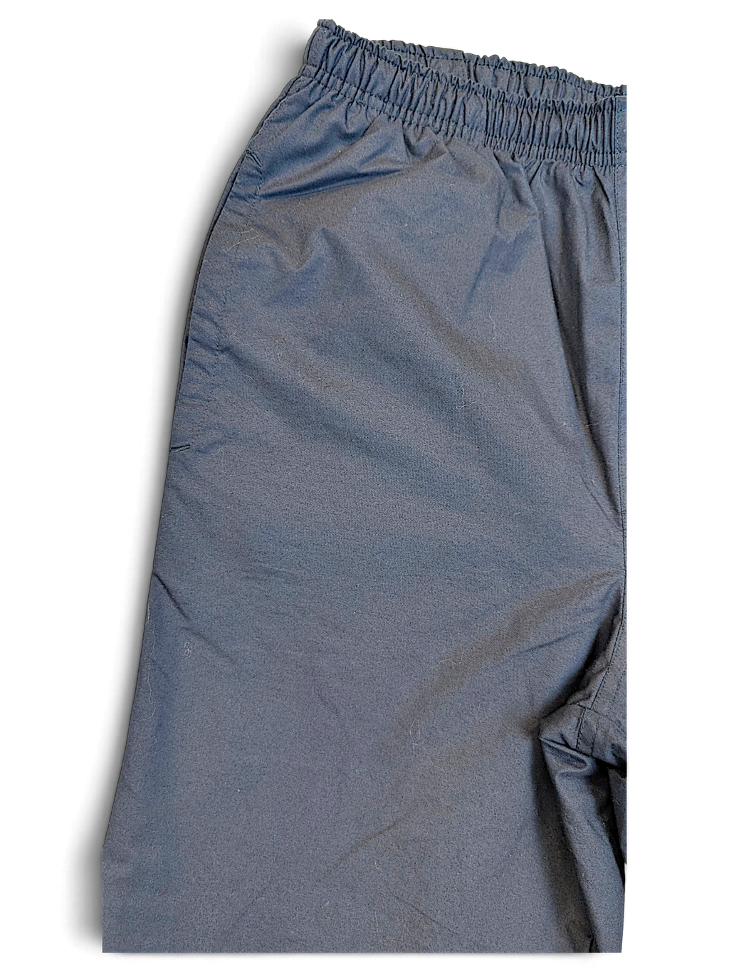JAKE & IPI pre-owned Nike navy windbreaker track pants with an elasticated waistband and lightweight shell fabric.
