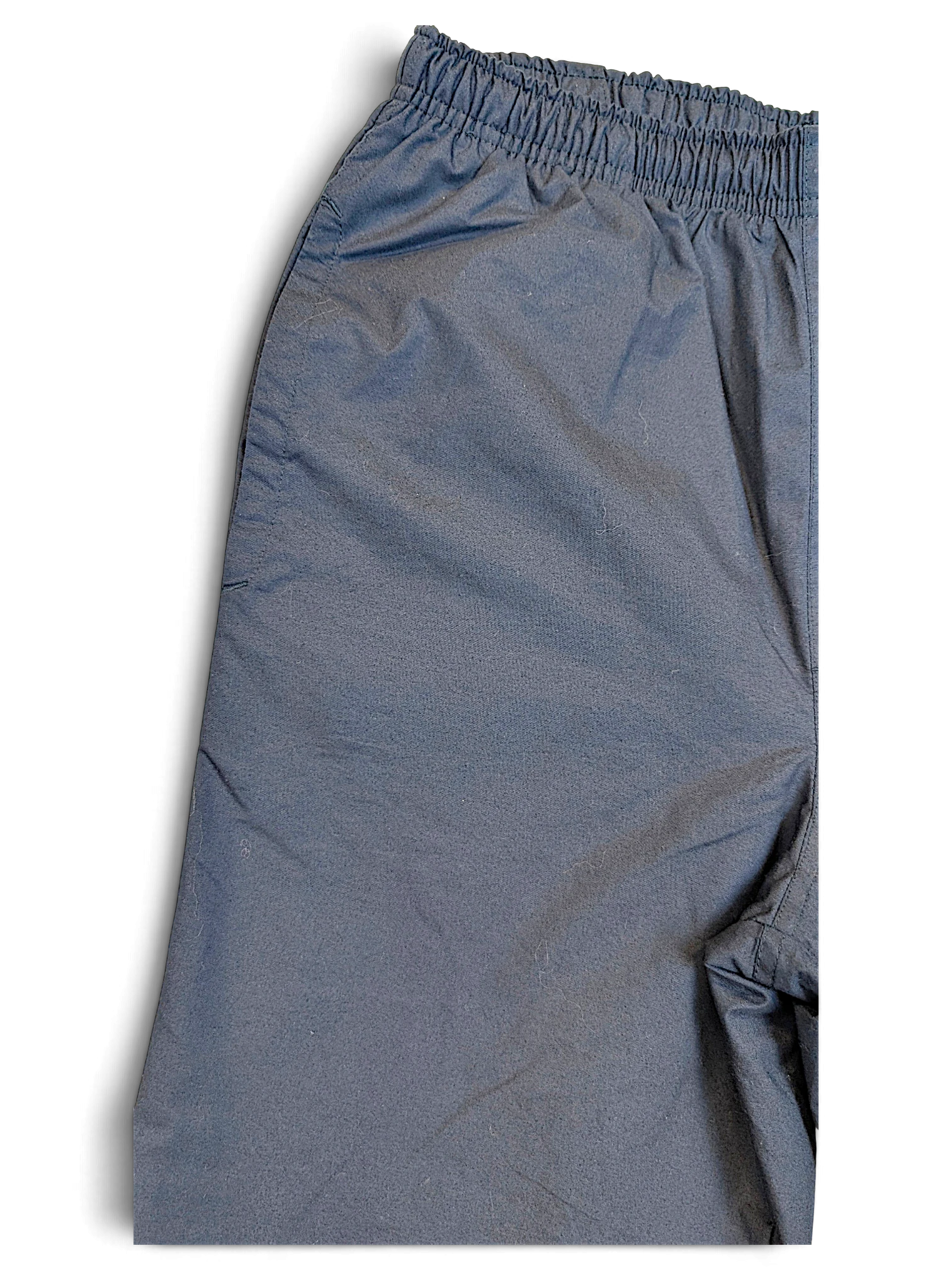 JAKE & IPI pre-owned Nike navy windbreaker track pants with an elasticated waistband and lightweight shell fabric.