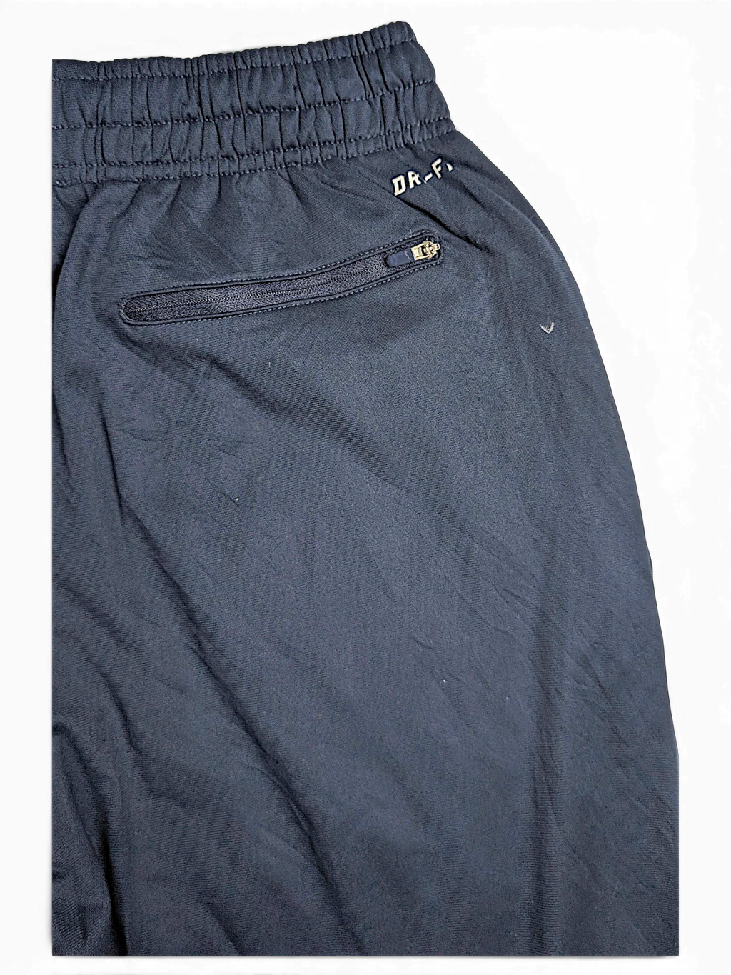 JAKE & IPI Nike NFL Chicago Bears navy blue Dri-FIT track pants with an elastic waistband and zippered pocket detail