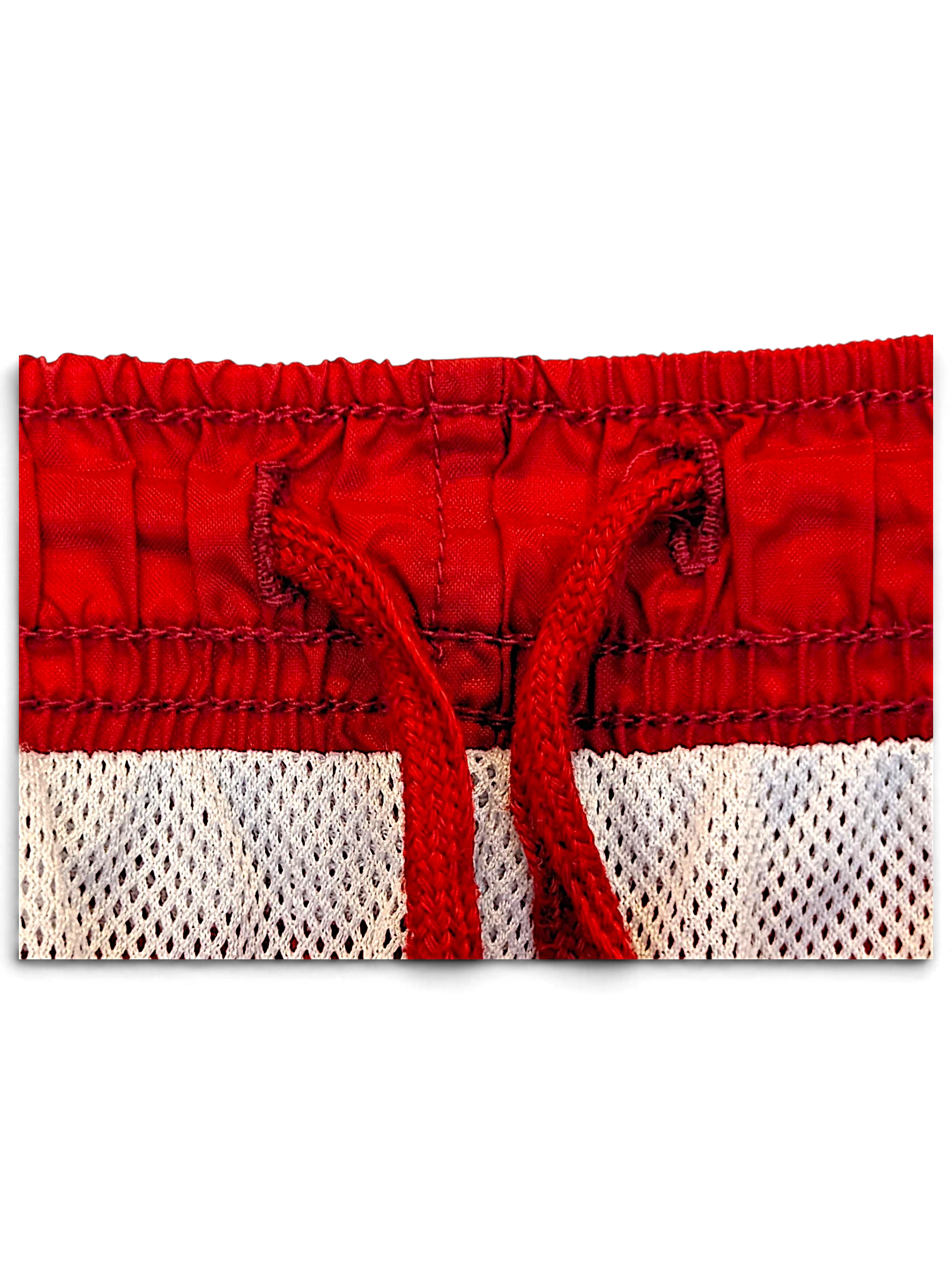 JAKE & IPI Nike red track pants featuring an elasticated waistband with a matching red drawstring and mesh lining.