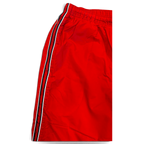 JAKE & IPI Nike red track pants featuring a black and white side stripe detail and an elasticated waistband.