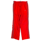 JAKE & IPI pre-owned red Nike track pants with black and white side stripes and white Swoosh logo
