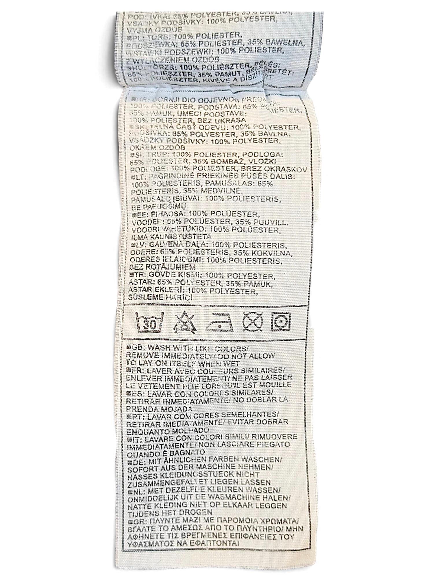 JAKE & IPI Nike track pants care and material composition label with washing instructions in multiple languages