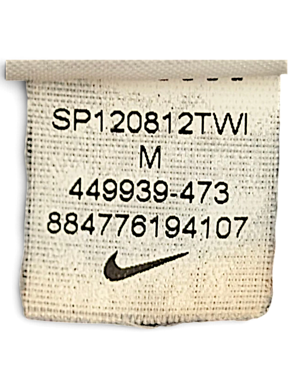 JAKE & IPI Nike track pants size M garment care label showing model number 449939-473 and Swoosh logo