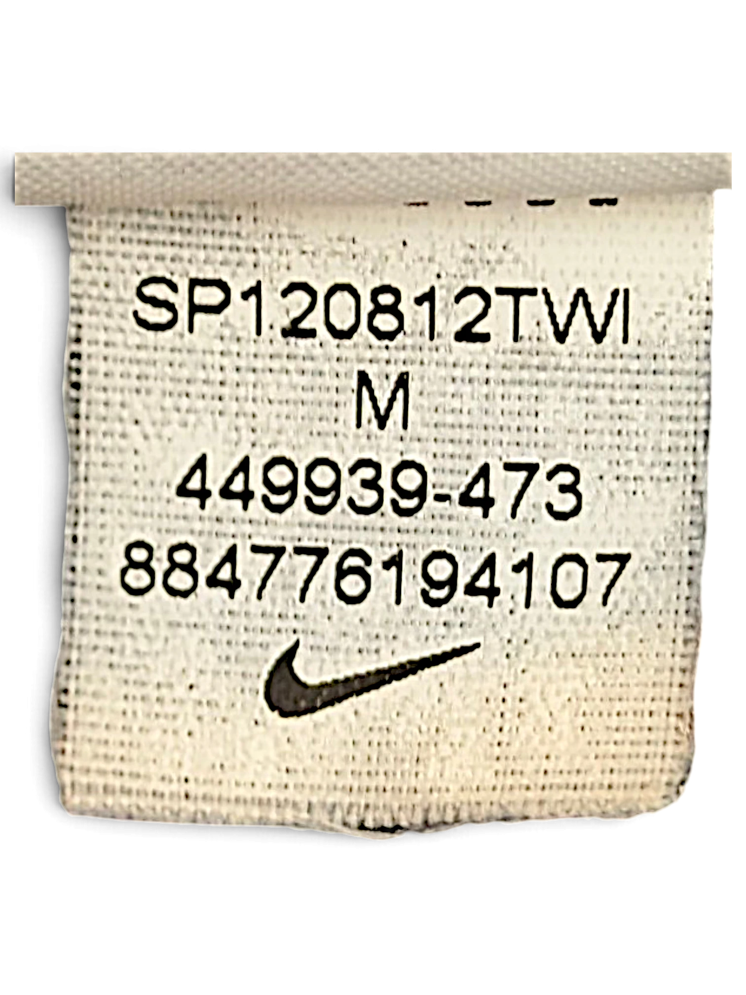JAKE & IPI Nike track pants size M garment care label showing model number 449939-473 and Swoosh logo