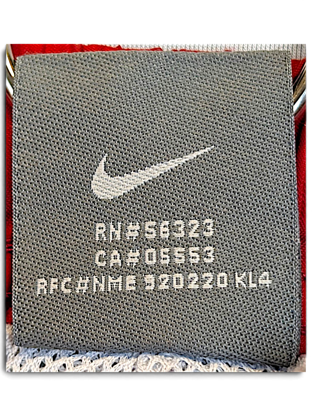 JAKE & IPI Nike track pants grey interior label with white Swoosh logo and registration numbers