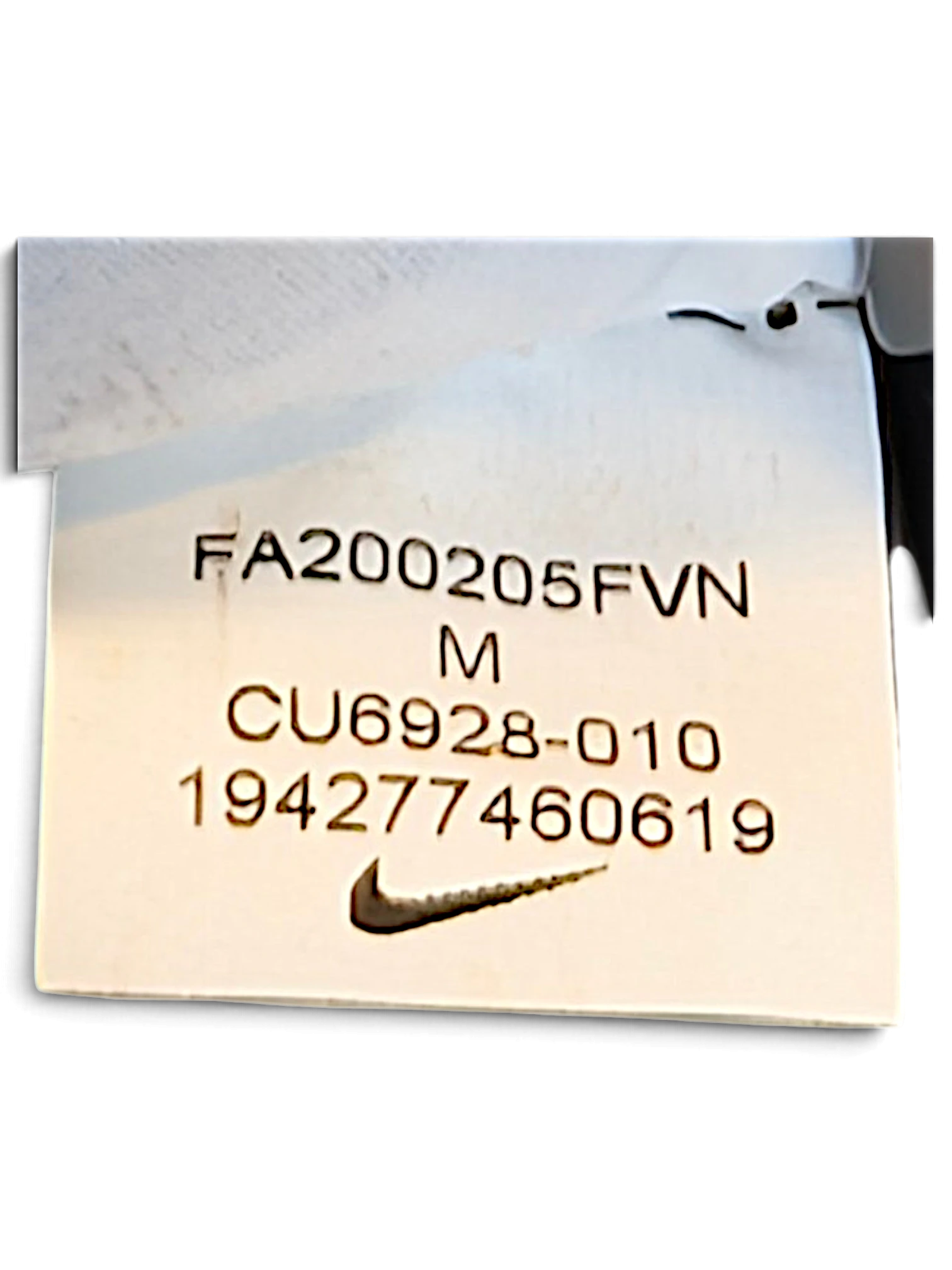 JAKE & IPI Nike Dri-FIT track pants interior care label showing size M and product code CU6928-010