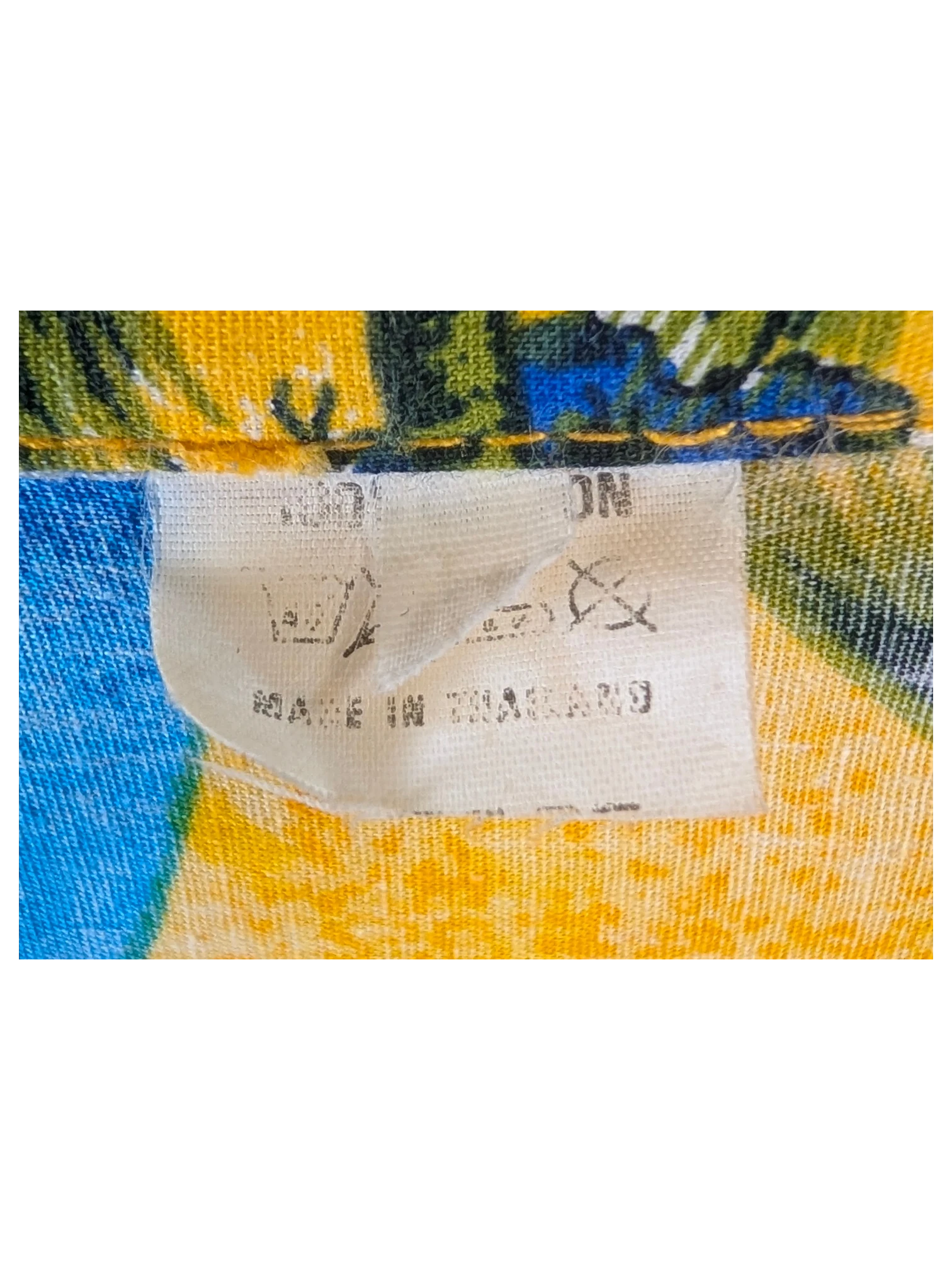 JAKE & IPI orange Hawaiian shirt featuring a tropical palm tree print and a fabric care label made in Thailand