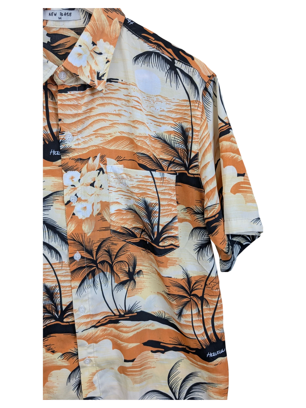 JAKE & IPI New Base Hawaiian shirt featuring a tropical orange and black palm tree sunset print with a chest pocket.