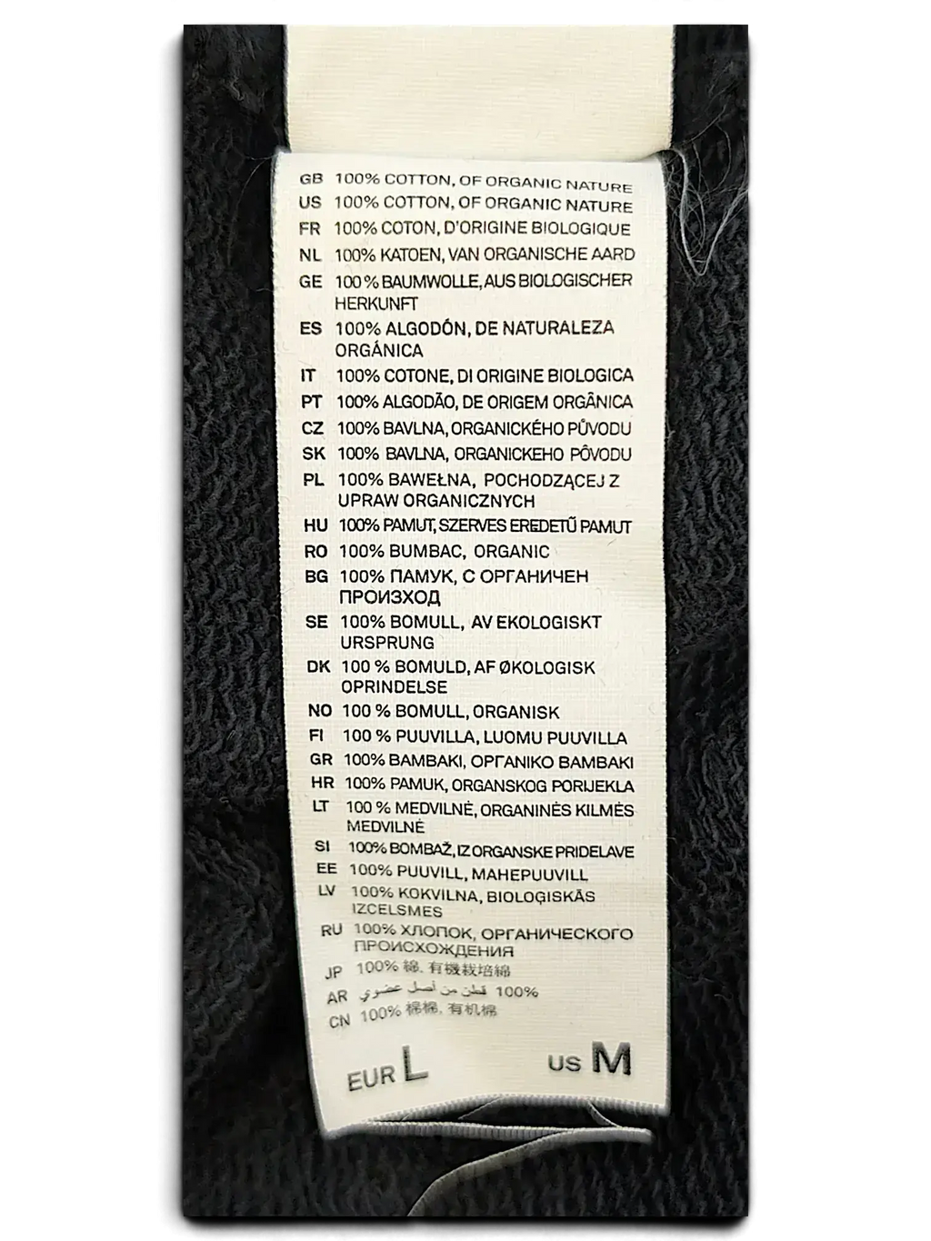 JAKE & IPI IBE Pyzze Hoodie white fabric care label detailing 100 percent organic cotton composition in many languages