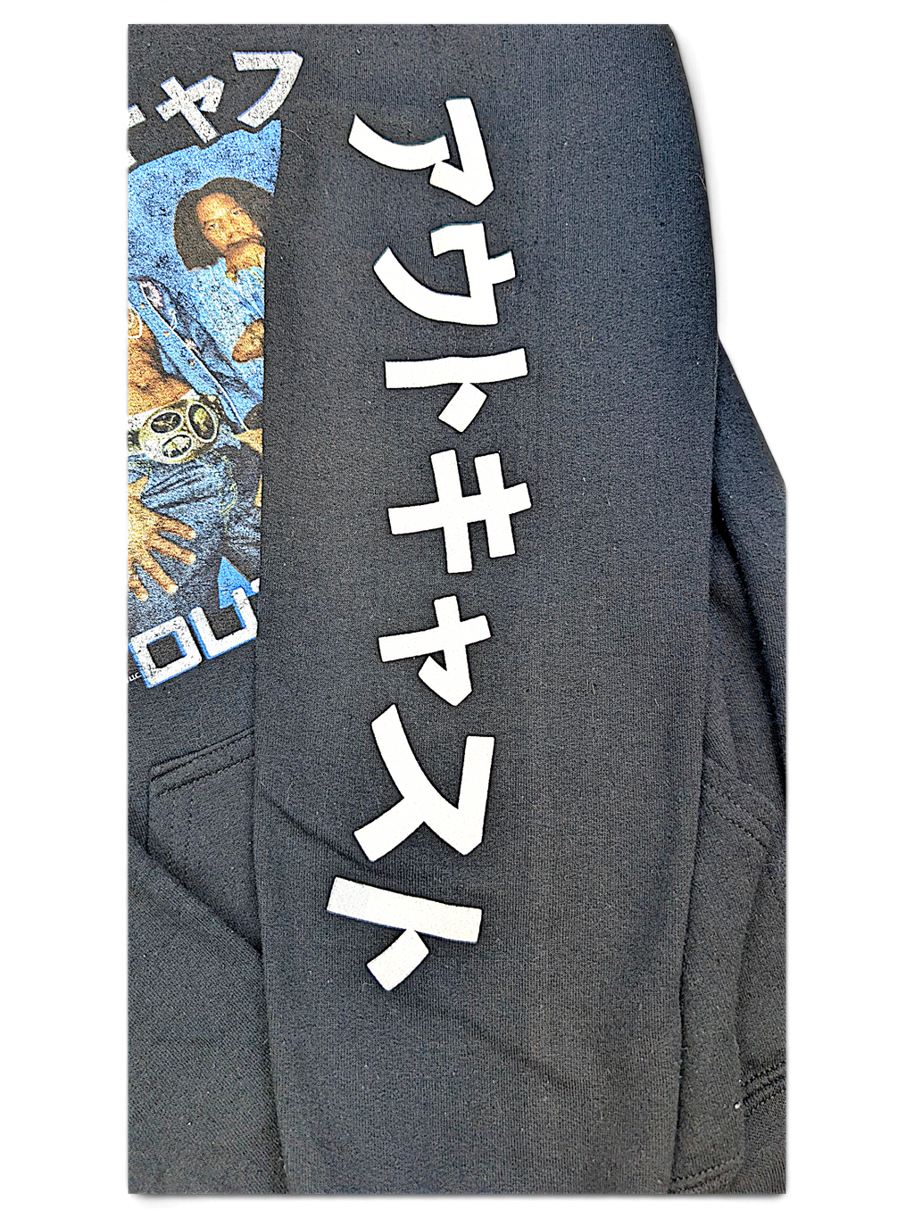 JAKE & IPI black Outkast hoodie featuring white Japanese text on the sleeve and a graphic print on the chest.