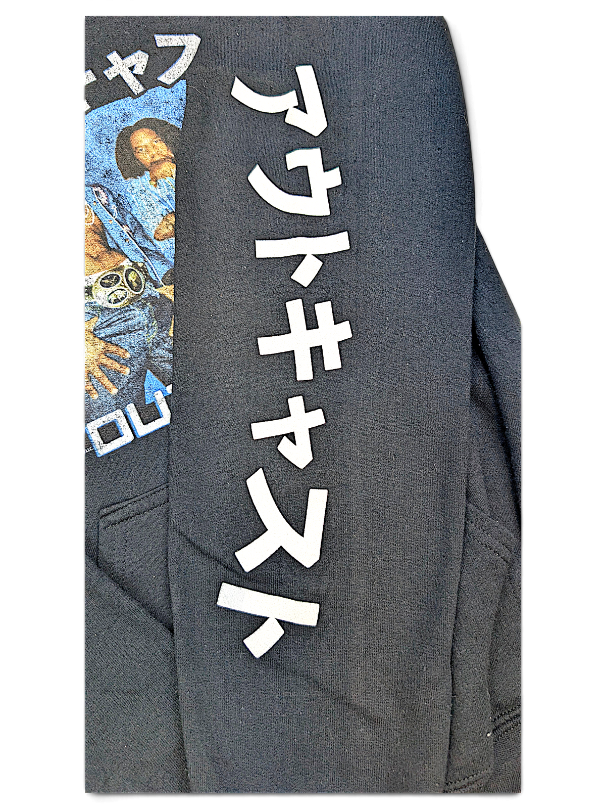 JAKE & IPI black Outkast hoodie featuring white Japanese text on the sleeve and a graphic print on the chest.