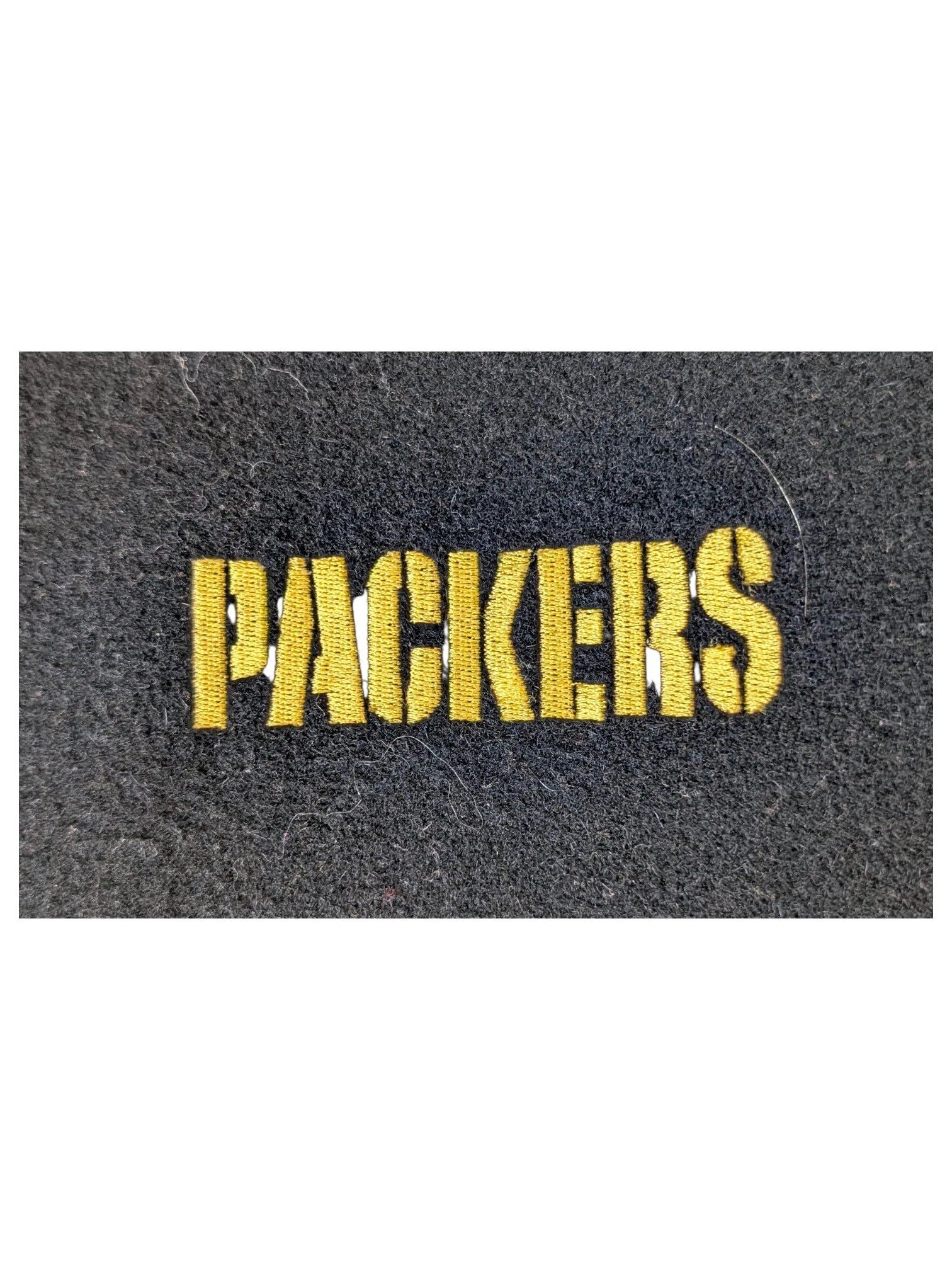 JAKE & IPI Jeff Hamilton varsity jacket featuring yellow embroidered Packers text on a black wool fabric background