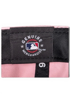 JAKE & IPI pink baseball cap interior showing Genuine Merchandise MLB branding and New Era label