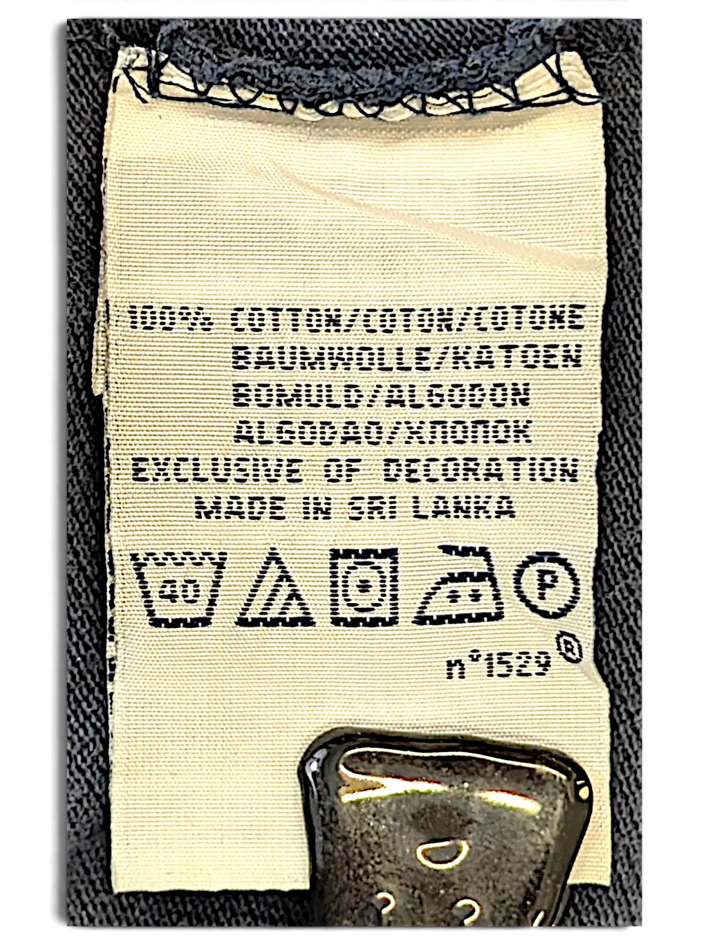 JAKE & IPI IBE Polo Big Pony Polo Shirt care label showing 100% cotton composition and washing instructions