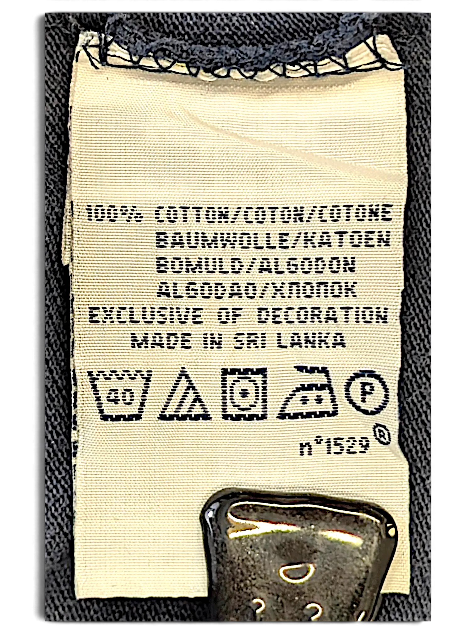 JAKE & IPI IBE Polo Big Pony Polo Shirt care label showing 100% cotton composition and washing instructions