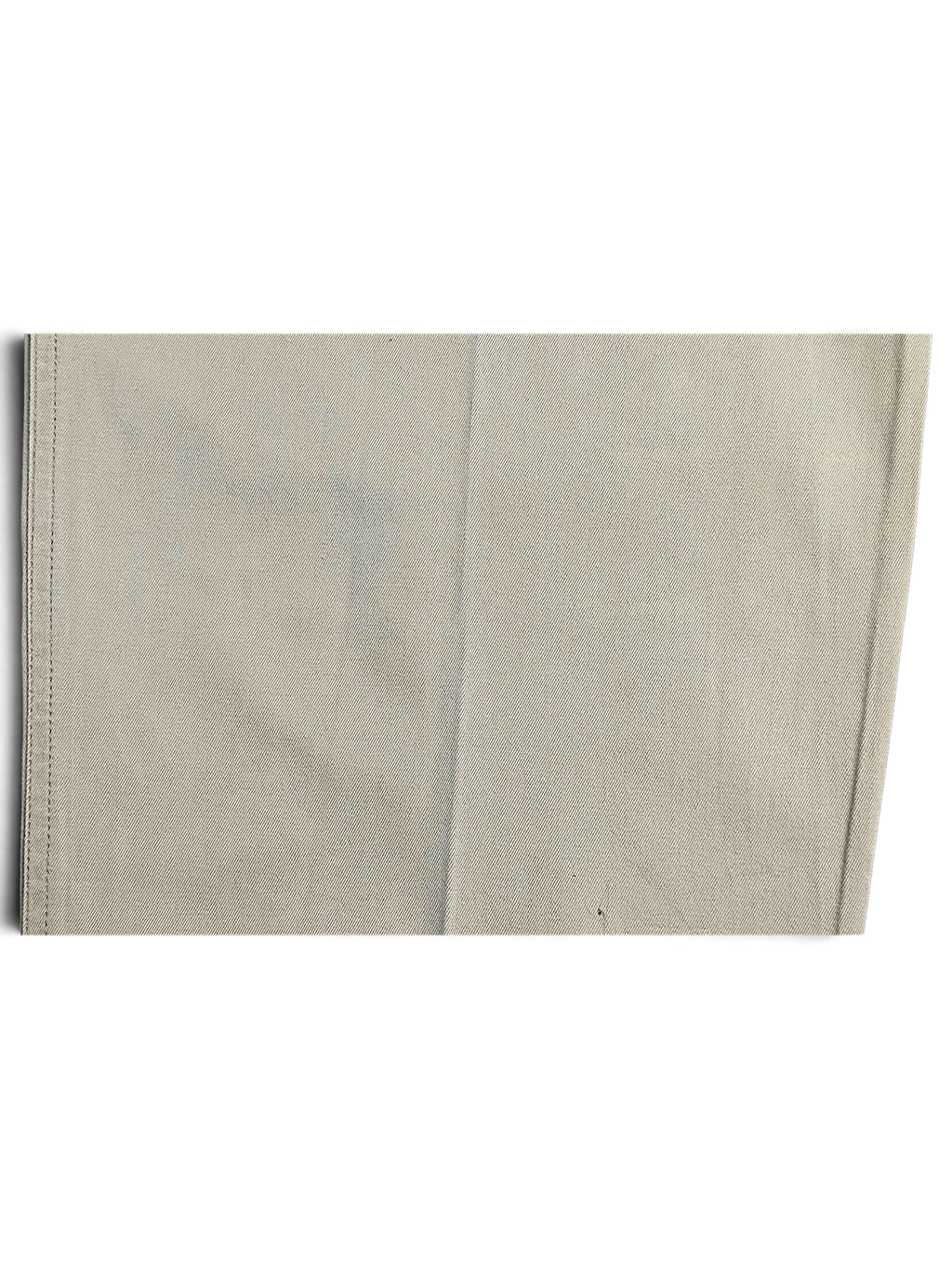 Close-up of JAKE & IPI Portobello’s beige pleated trousers fabric showing texture and visible discoloration marks