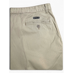 JAKE & IPI Portobello’s beige trousers featuring a back pocket with button closure and brand label detail.