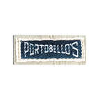 JAKE & IPI Portobello’s brand clothing label stitched on beige fabric